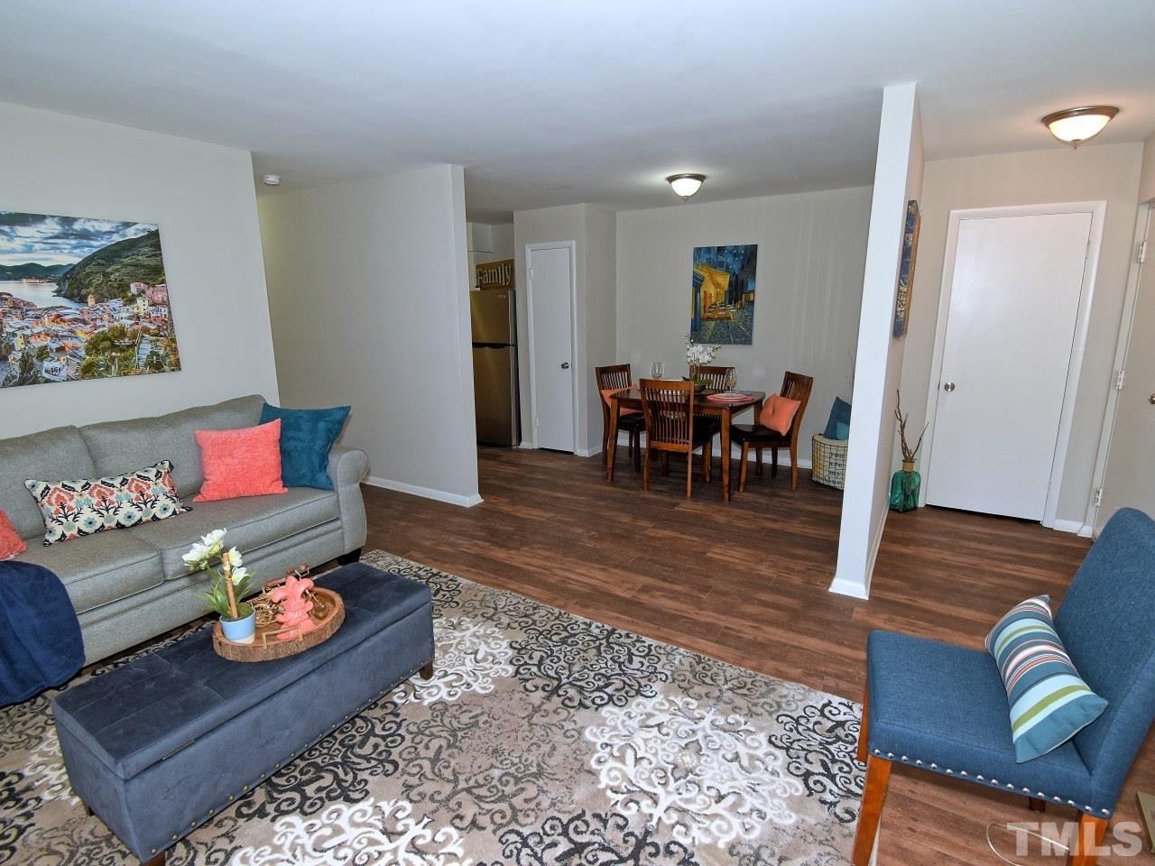 1000 Sandlin Place, Unit A Raleigh, NC 27606 - Photo 2 of 17 a living room with furniture and wooden floor