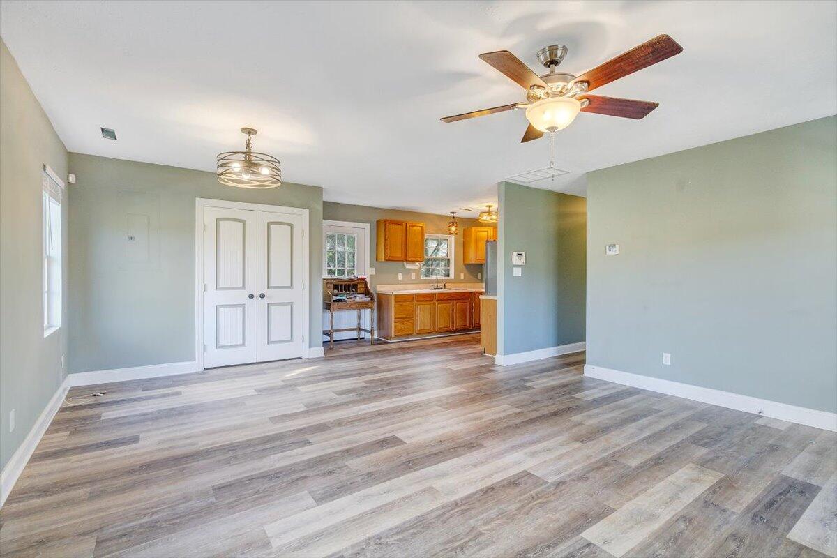 602 River Road Madison Heights, VA 24572 - Photo 3 of 24 a view of an empty room with a window and wooden floor