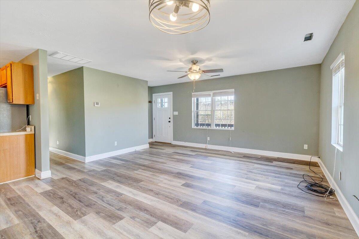 602 River Road Madison Heights, VA 24572 - Photo 4 of 24 a view of an empty room with wooden floor and a window