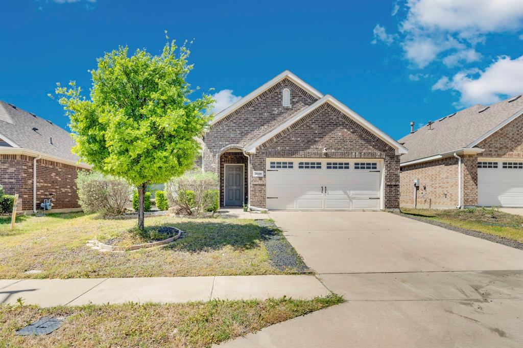 2609 Centurion Road Glenn Heights, TX 75154 - Photo 1 of 29 View of front of home featuring an attached garage, brick siding, and concrete driveway
