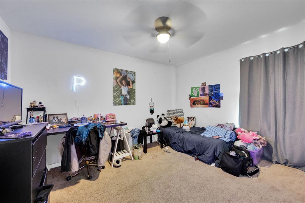 2609 Centurion Road Glenn Heights, TX 75154 - Photo 20 of 29 Carpeted bedroom featuring ceiling fan and a desk