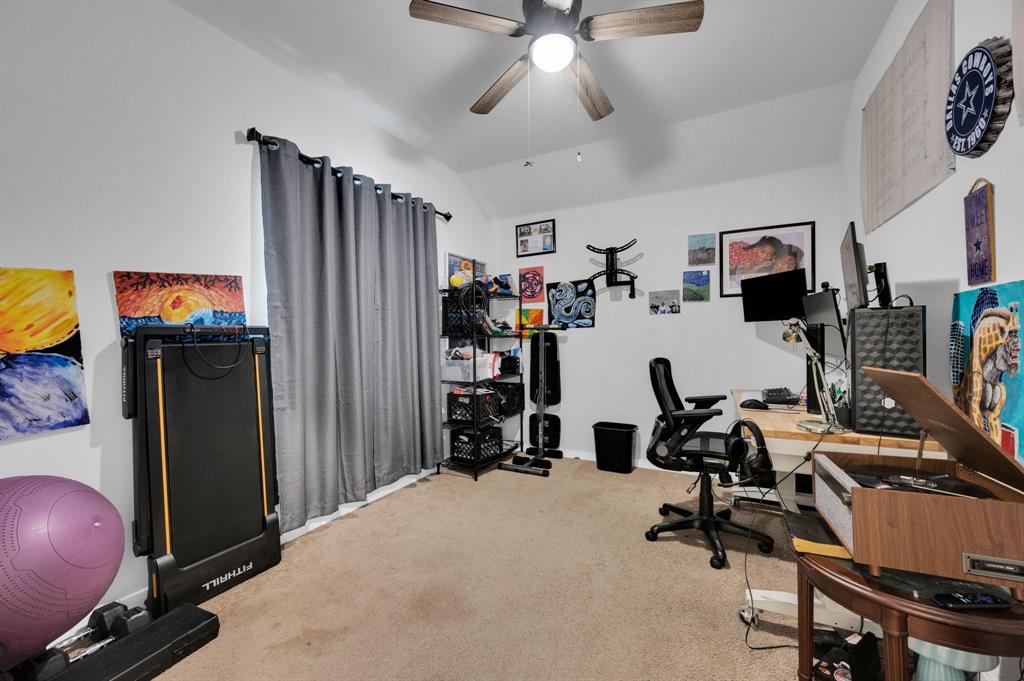 2609 Centurion Road Glenn Heights, TX 75154 - Photo 21 of 29 Home office featuring light carpet, vaulted ceiling, and a ceiling fan