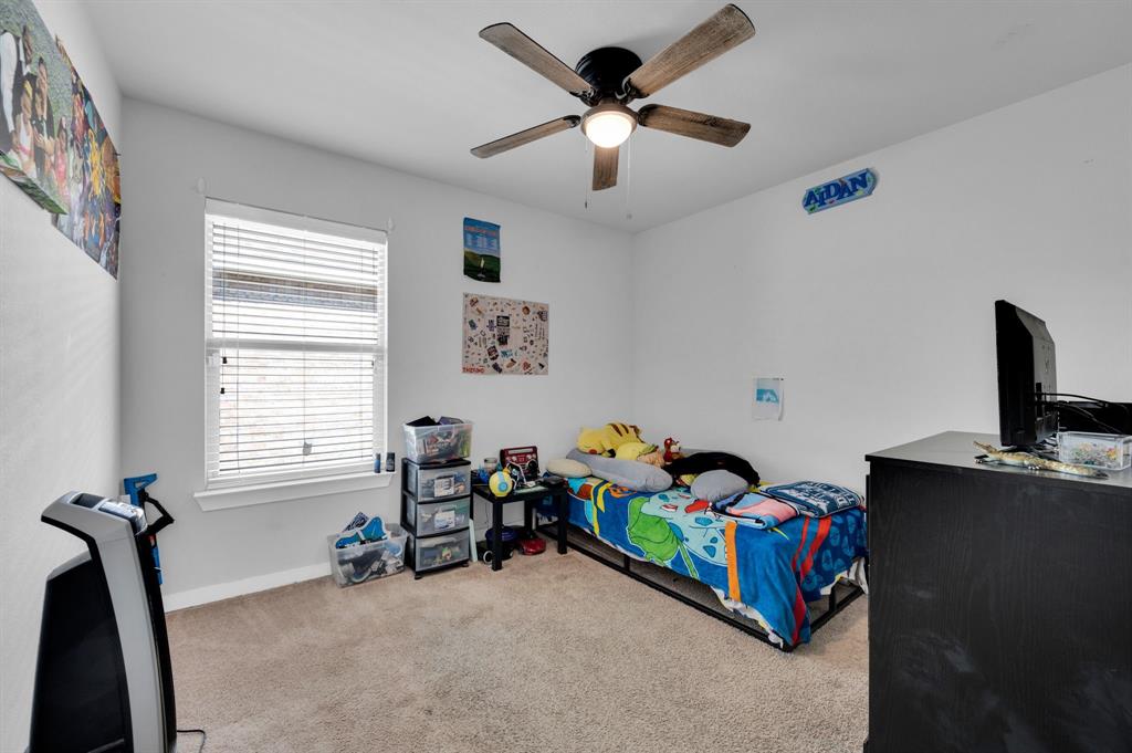 2609 Centurion Road Glenn Heights, TX 75154 - Photo 22 of 29 Bedroom with light colored carpet and ceiling fan