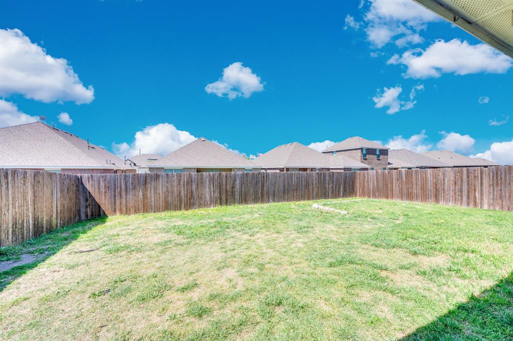 2609 Centurion Road Glenn Heights, TX 75154 - Photo 27 of 29 Fenced backyard featuring a residential view