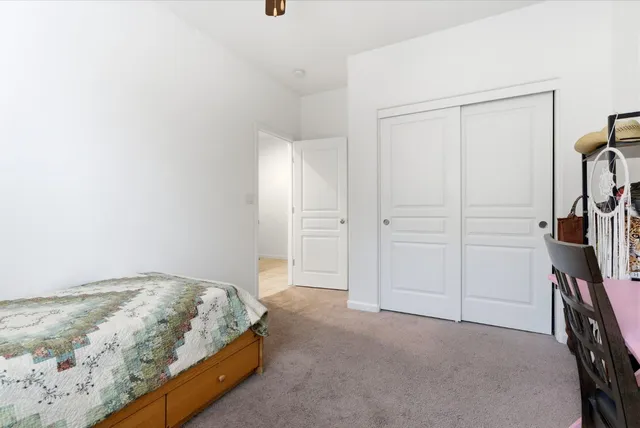 a bedroom with a bed and a view of bedroom