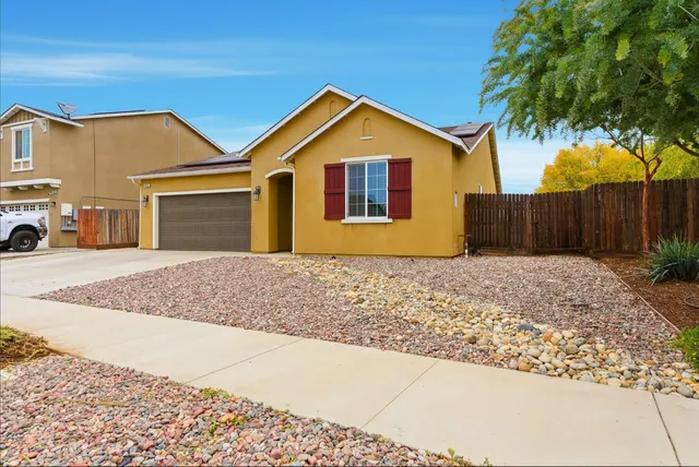 a view of front of house with a yard