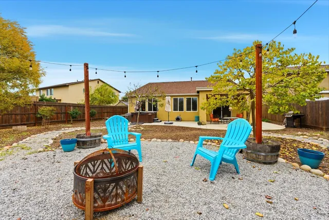 a view of a two chairs in the patio
