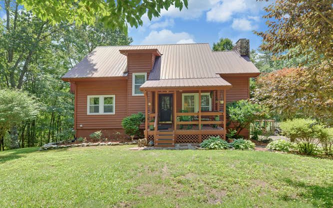 322 Beaver Rdg Trail Murphy, NC 28906 - Photo 1 of 1 a front view of a house with a garden