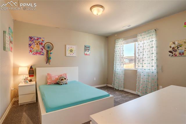 10946 Avena Road Peyton, CO 80831 - Photo 16 of 23 Bedroom 2 Upstairs