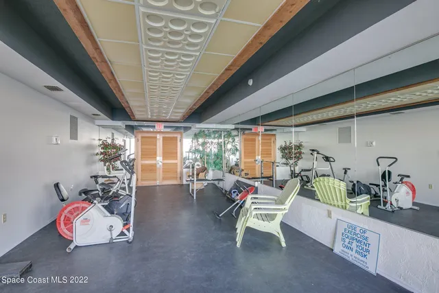a room with furniture and gym equipment