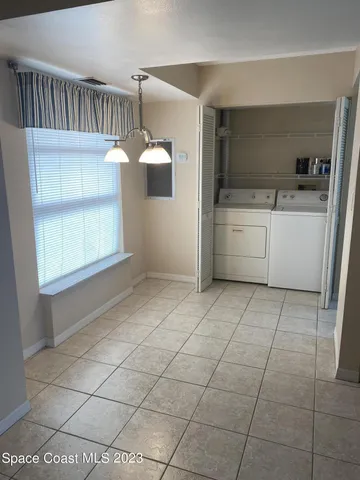 a kitchen with a sink a stove and cabinets