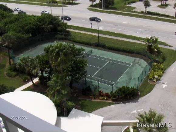 a picture of a building with a yard and plants