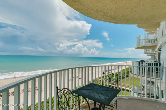 a view of balcony with furniture