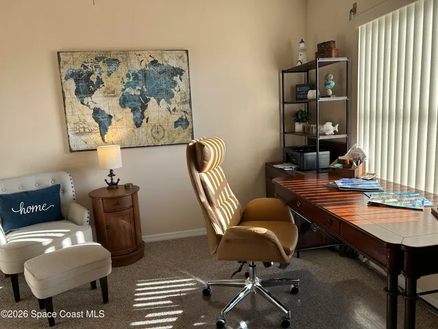 a work room with furniture and wooden floor