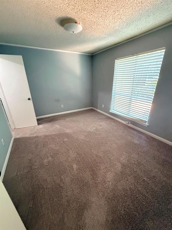 4845 Cedar Springs Road, Unit 174 Dallas, TX 75219 - Photo 12 of 19 a view of an empty room with a window
