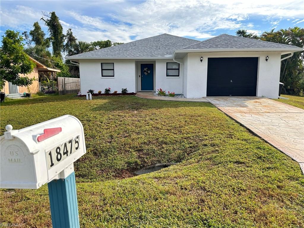 18475 Evergreen Road Fort Myers, FL 33967 - Photo 1 of 30 a front view of a house with yard