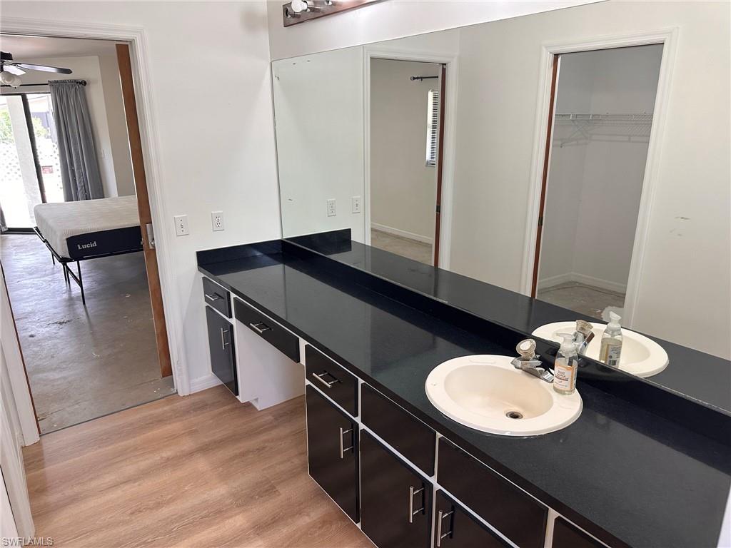 18475 Evergreen Road Fort Myers, FL 33967 - Photo 13 of 30 a bathroom with a sink mirror and toilet
