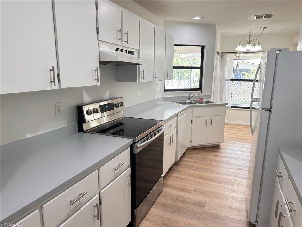 18475 Evergreen Road Fort Myers, FL 33967 - Photo 2 of 30 a kitchen with stainless steel appliances a sink stove and refrigerator
