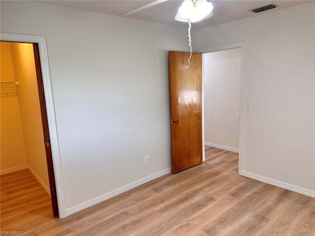 18475 Evergreen Road Fort Myers, FL 33967 - Photo 22 of 30 a view of empty room with wooden floor