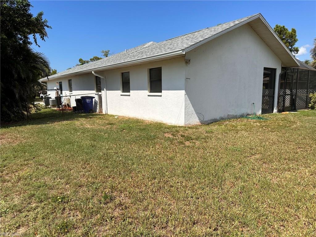 18475 Evergreen Road Fort Myers, FL 33967 - Photo 27 of 30 a front view of house with yard and trees