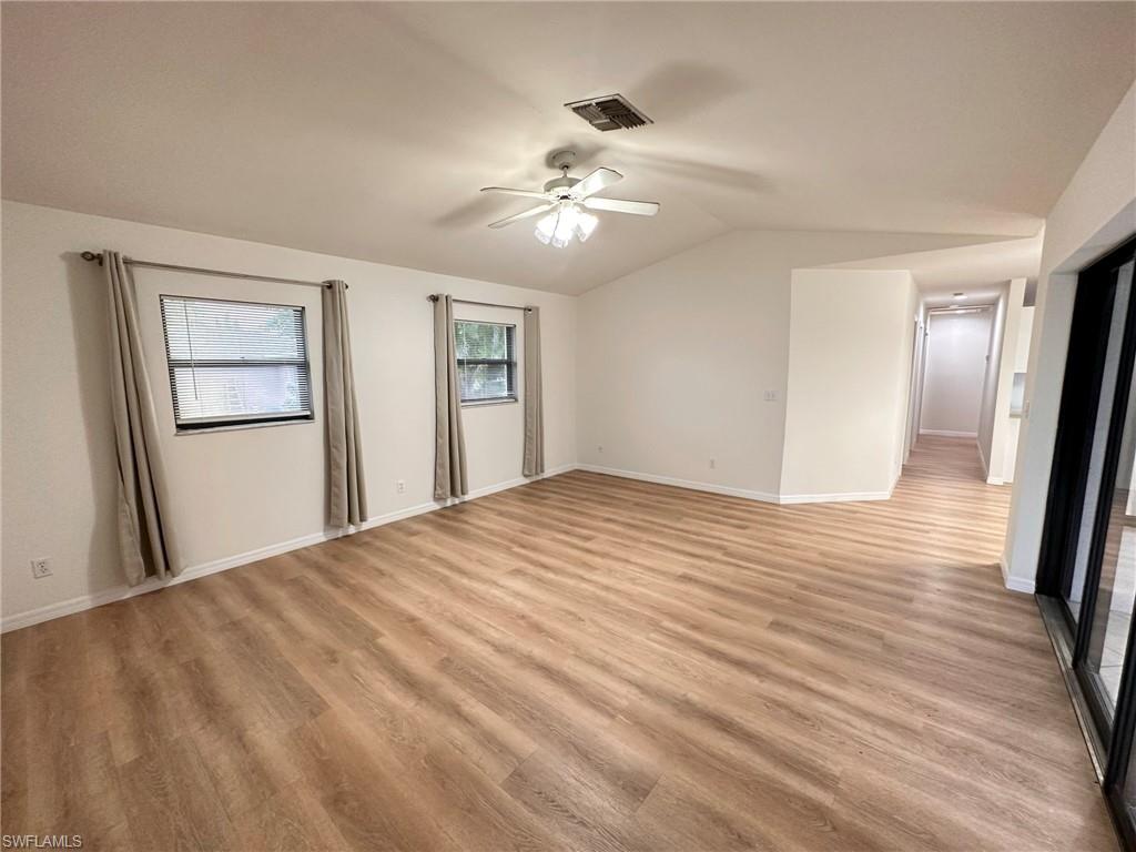 18475 Evergreen Road Fort Myers, FL 33967 - Photo 8 of 30 a view of a livingroom with wooden floor and a ceiling fan