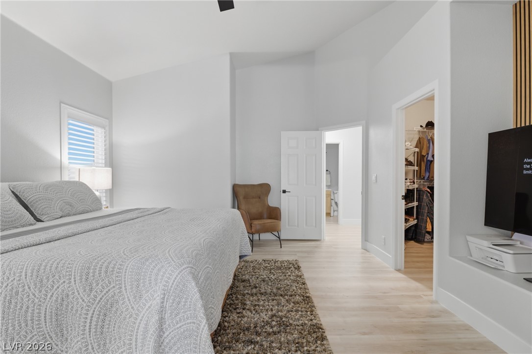 239 Highgate Street Henderson, NV 89074 - Photo 17 of 44 Retreat to a spa-inspired primary suite featuring a soaking tub, a beautifully tiled walk-in shower, dual vanities with upgraded countertops, & a spacious walk-in closet.