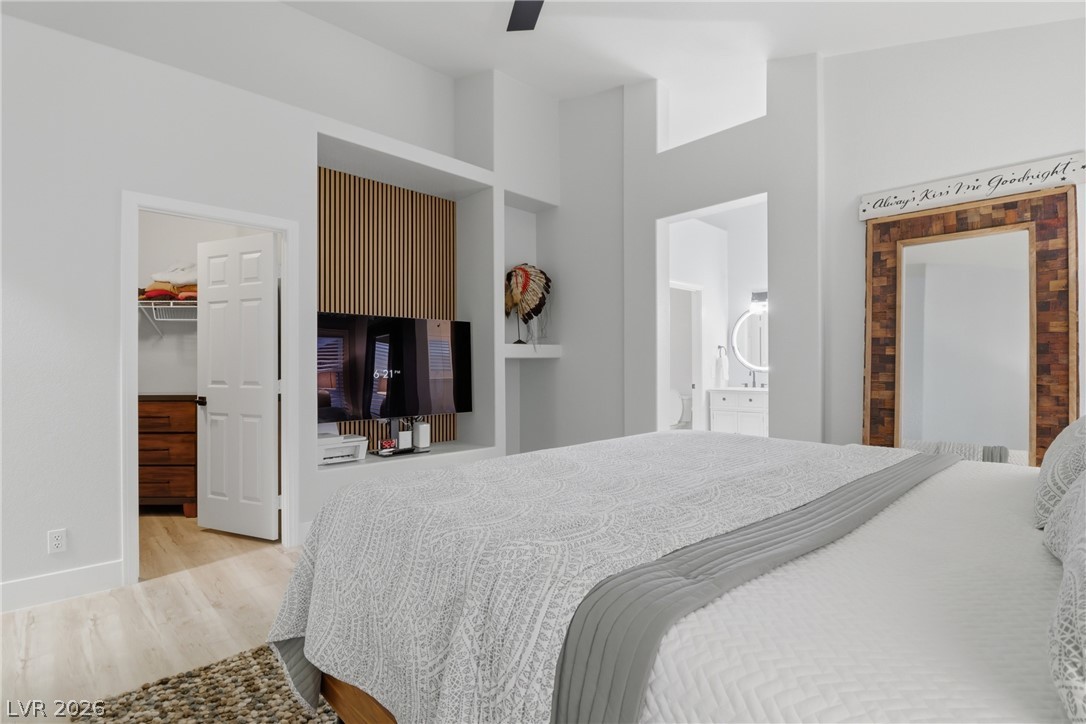 239 Highgate Street Henderson, NV 89074 - Photo 18 of 44 Retreat to a spa-inspired primary suite featuring a soaking tub, a beautifully tiled walk-in shower, dual vanities with upgraded countertops, & a spacious walk-in closet.