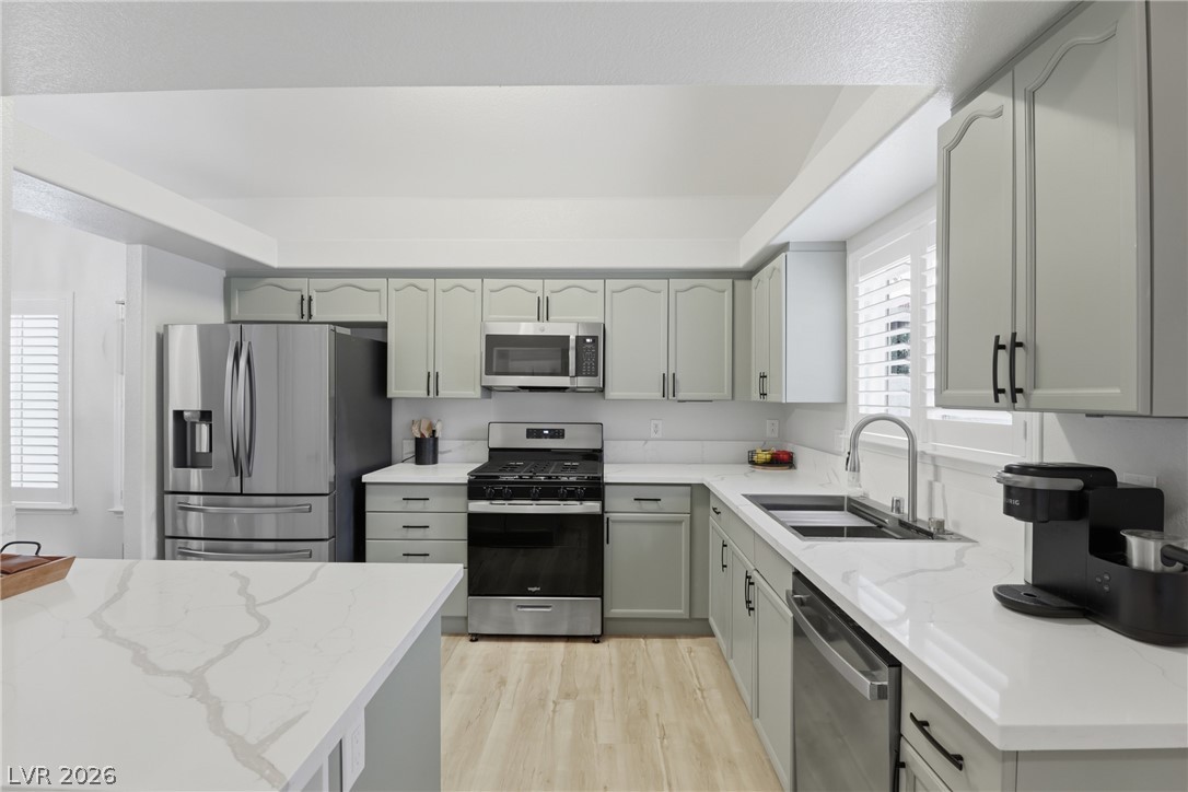 239 Highgate Street Henderson, NV 89074 - Photo 2 of 44 The chef’s kitchen is anchored by top-of-the-line stainless steel appliances, stunning quartz countertops, & striking custom cabinetry with designer hardware.