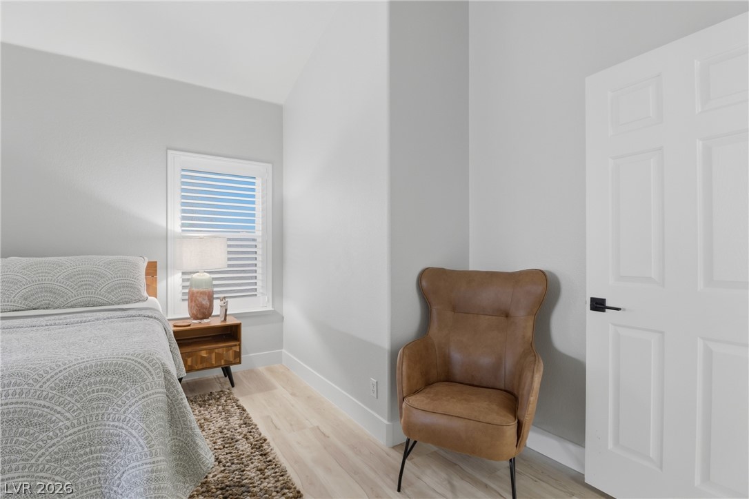 239 Highgate Street Henderson, NV 89074 - Photo 25 of 44 Retreat to a spa-inspired primary suite featuring a soaking tub, a beautifully tiled walk-in shower, dual vanities with upgraded countertops, & a spacious walk-in closet.