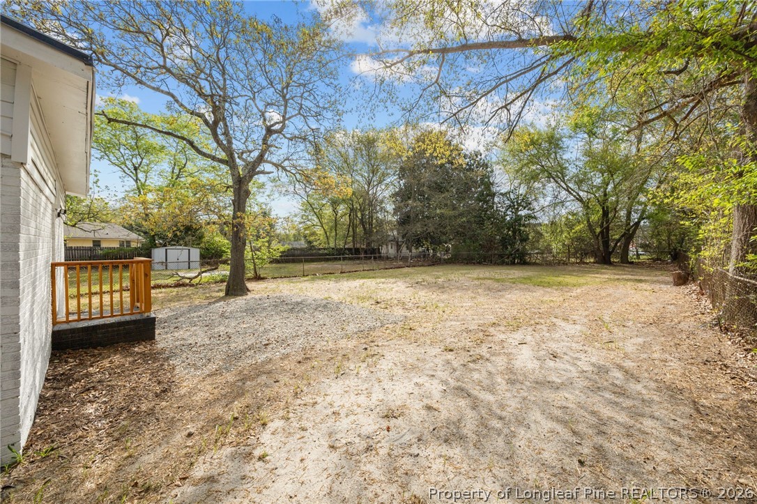 625 Eva Circle Spring Lake, NC 28390 - Photo 23 of 28 a view of a yard with a house and trees