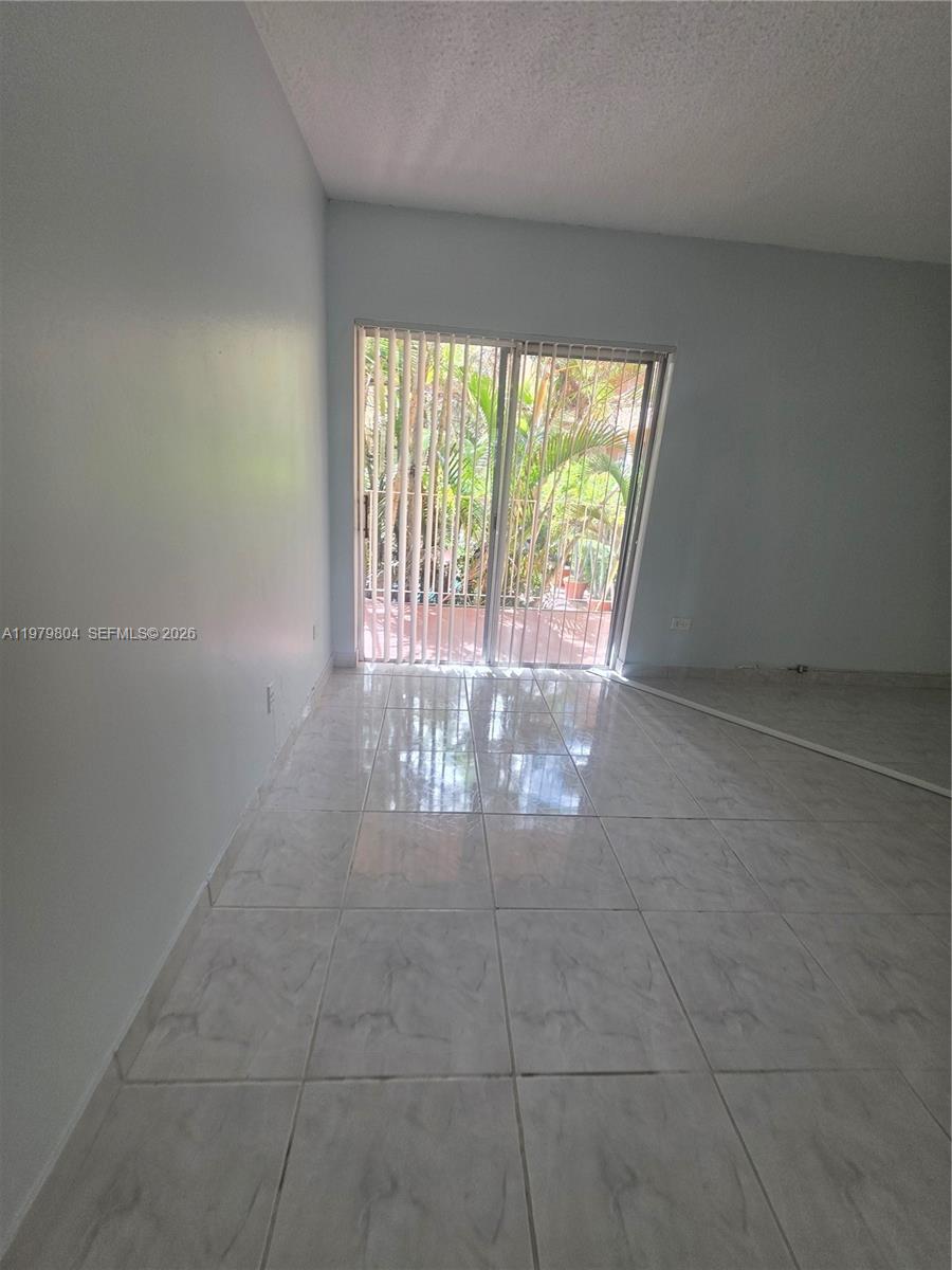 8101 Southwest 73rd Avenue, Unit 17 Miami, FL 33143 - Photo 31 of 66 a view of an empty room with a window