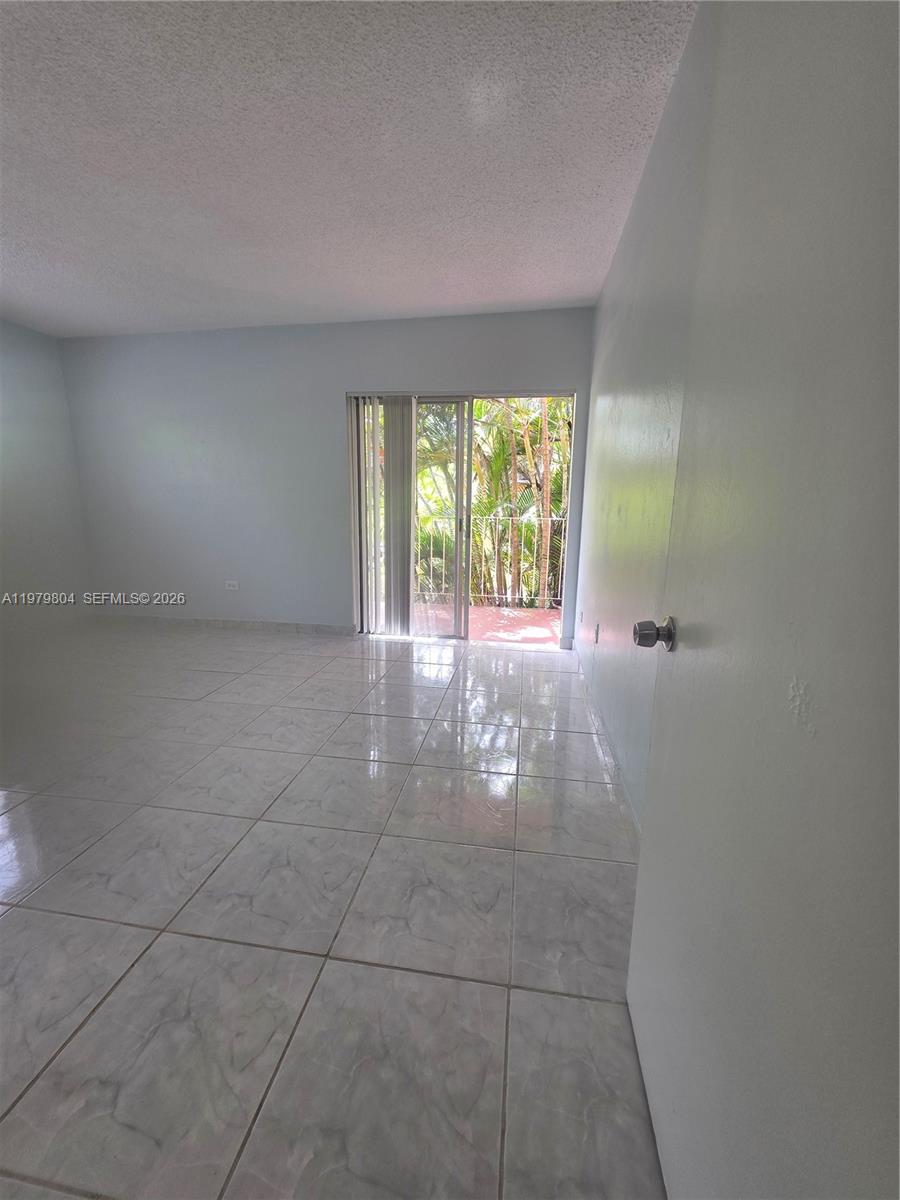 8101 Southwest 73rd Avenue, Unit 17 Miami, FL 33143 - Photo 35 of 66 a view of an empty room with a window