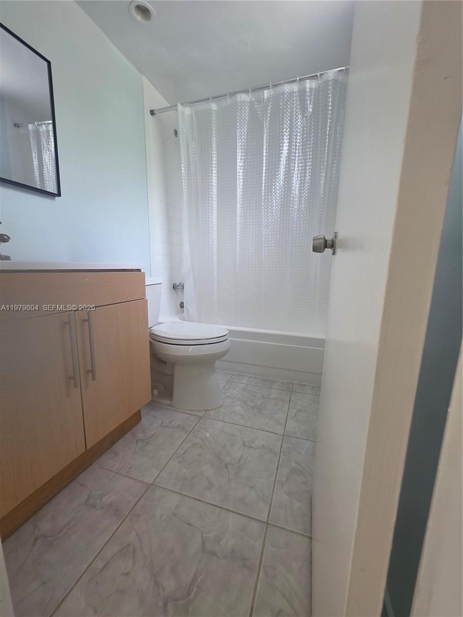 8101 Southwest 73rd Avenue, Unit 17 Miami, FL 33143 - Photo 36 of 66 a bathroom with a shower and a toilet