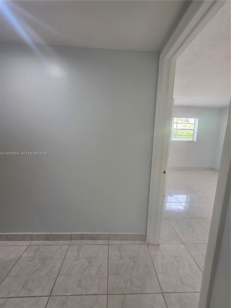 8101 Southwest 73rd Avenue, Unit 17 Miami, FL 33143 - Photo 38 of 66 a view of an empty room and window