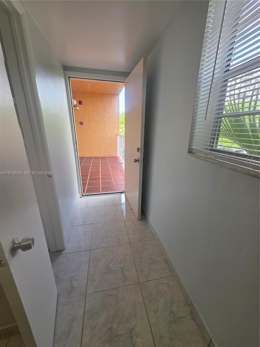 8101 Southwest 73rd Avenue, Unit 17 Miami, FL 33143 - Photo 49 of 66 a view of an empty room and window
