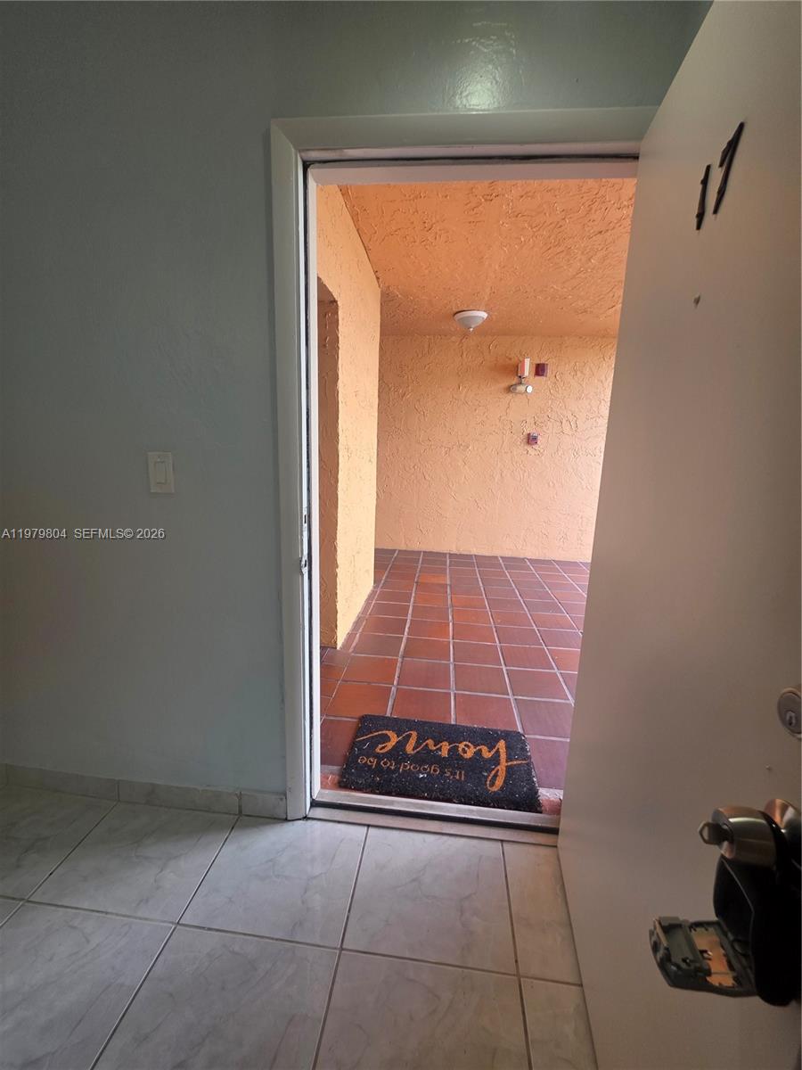 8101 Southwest 73rd Avenue, Unit 17 Miami, FL 33143 - Photo 53 of 66 a view of a door and wooden floor