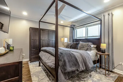 a bed room with a bed and a dresser