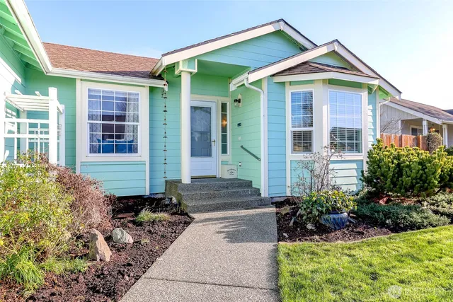a front view of a house with garden