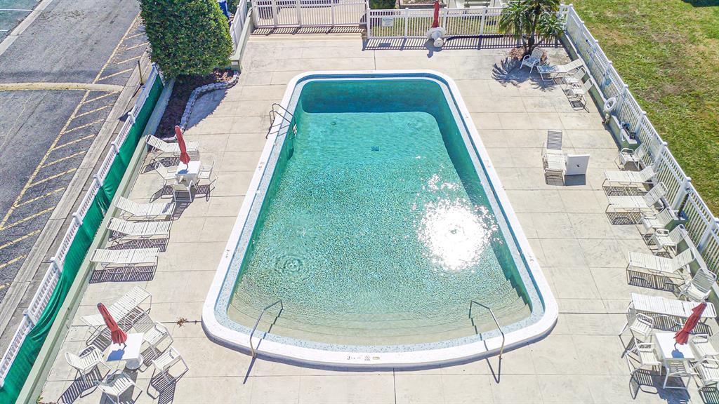 1433 South Belcher Road, Unit F11 Clearwater, FL 33764 - Photo 21 of 21 a view of a swimming pool with a porch