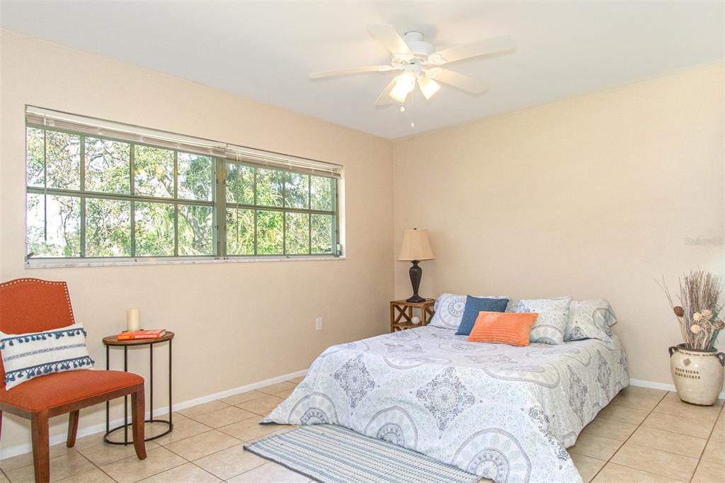 1433 South Belcher Road, Unit F11 Clearwater, FL 33764 - Photo 10 of 21 a bedroom with a bed and a window