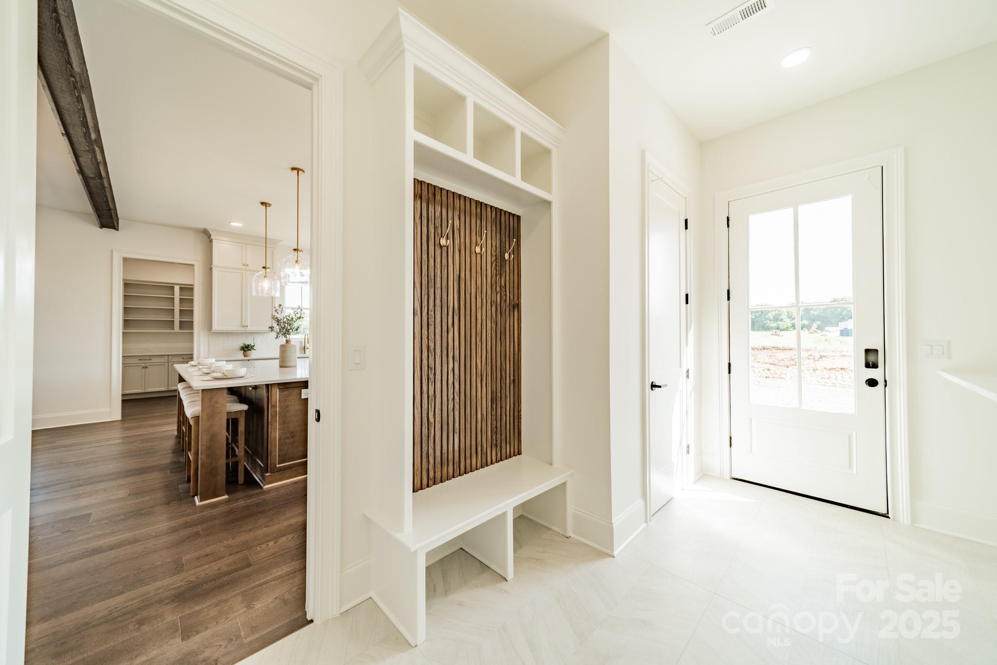 2346 Bridgewater Road, Unit 7 Rock Hill, SC 29730 - Photo 15 of 34 a view of a hallway with wooden floor windows and a living room