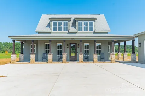 front view of a brick house with a large window