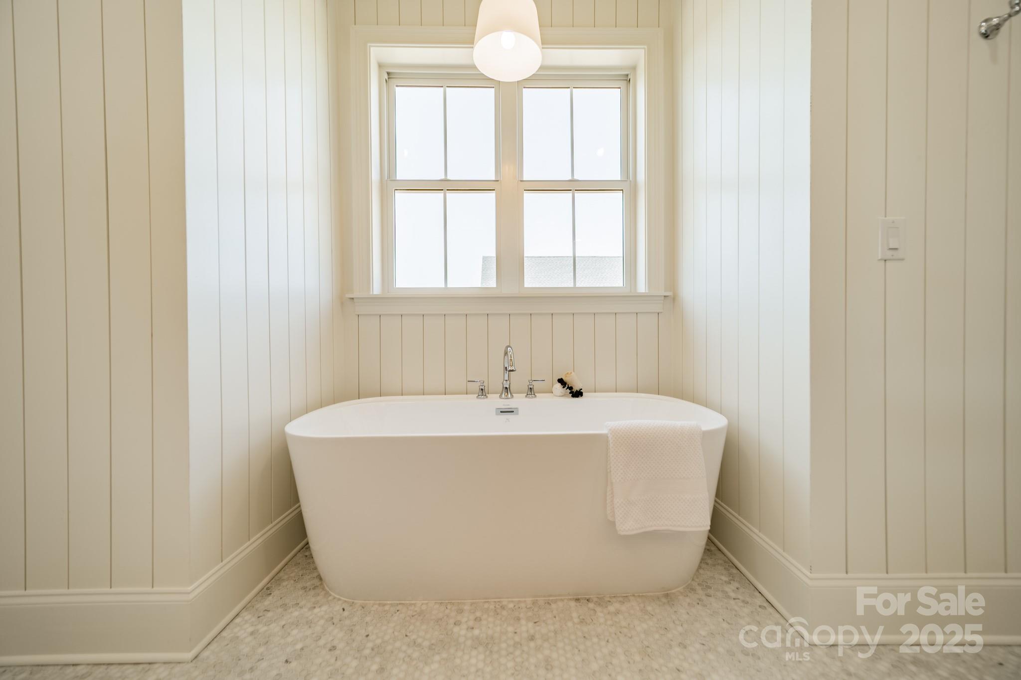 2346 Bridgewater Road, Unit 7 Rock Hill, SC 29730 - Photo 21 of 34 a white bath tub sitting in a bathroom next to a window