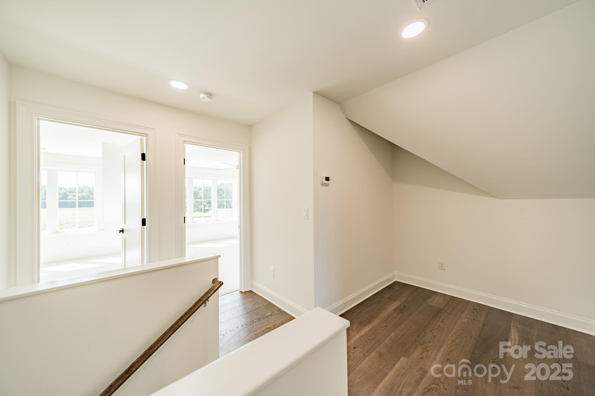 2346 Bridgewater Road, Unit 7 Rock Hill, SC 29730 - Photo 25 of 34 a view of an empty room with wooden floor and a window