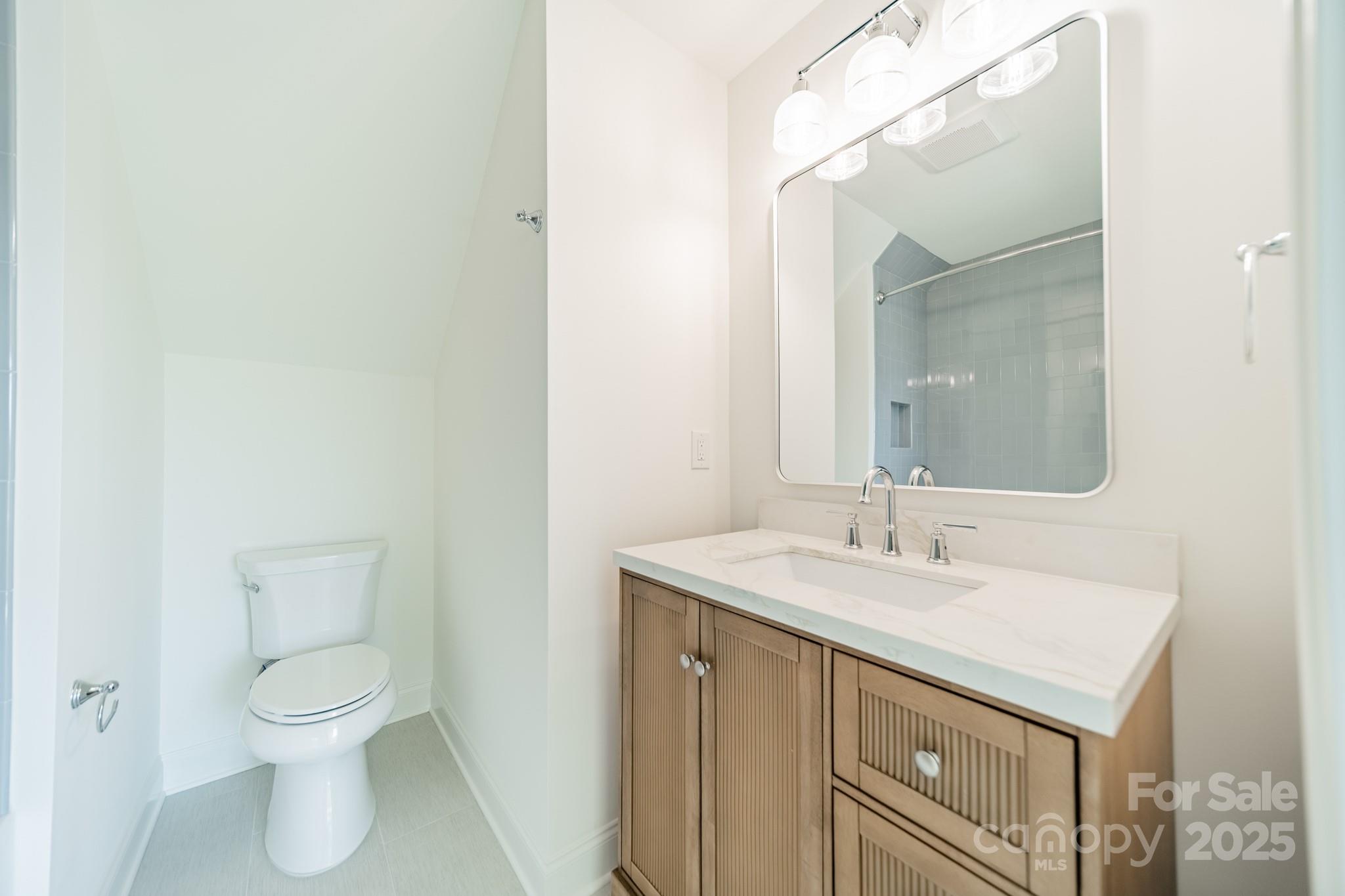 2346 Bridgewater Road, Unit 7 Rock Hill, SC 29730 - Photo 27 of 34 a bathroom with a toilet sink and mirror
