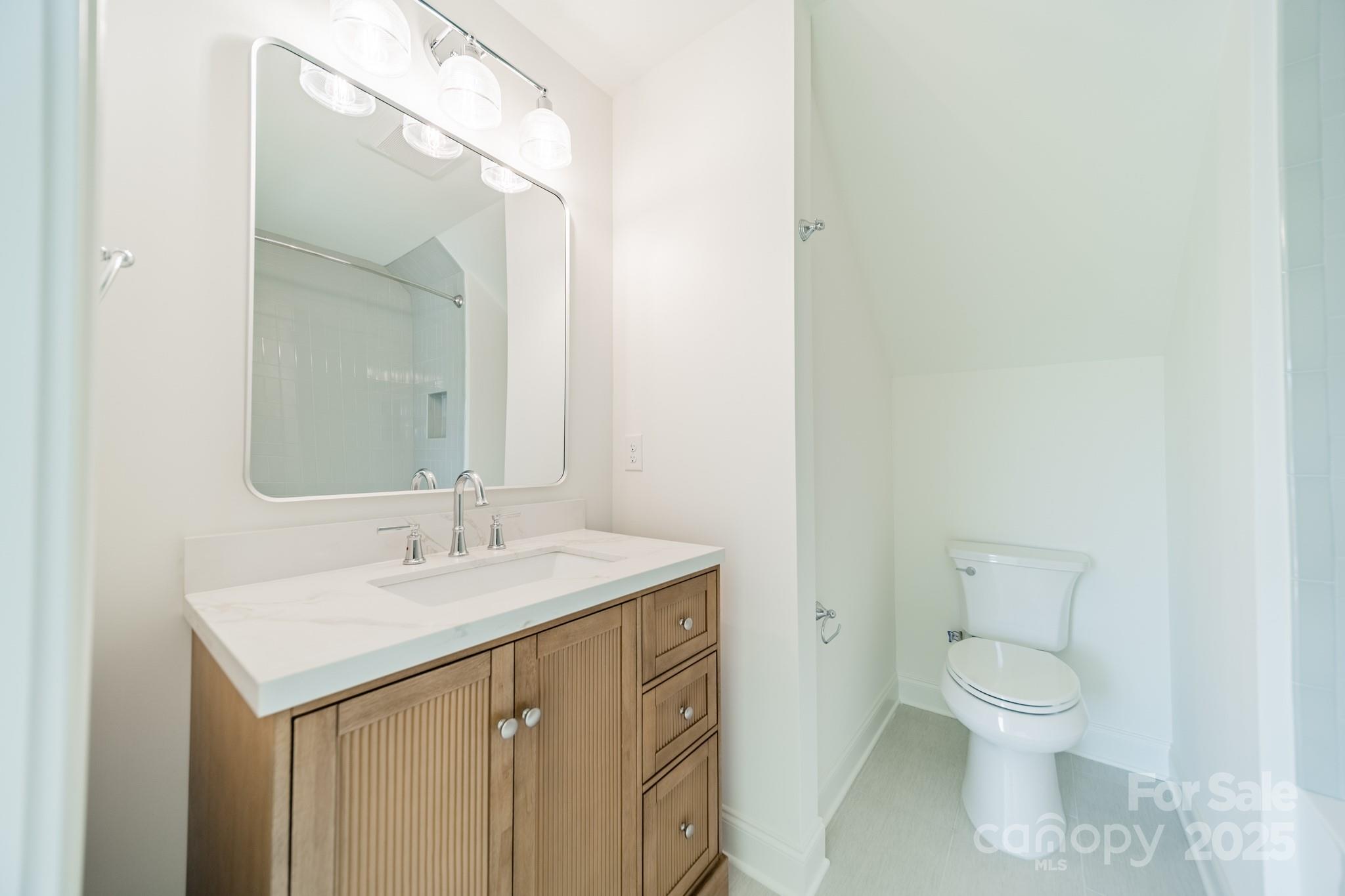 2346 Bridgewater Road, Unit 7 Rock Hill, SC 29730 - Photo 30 of 34 a bathroom with a toilet sink and mirror