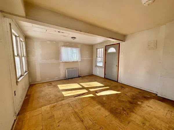 a view of empty room with windows