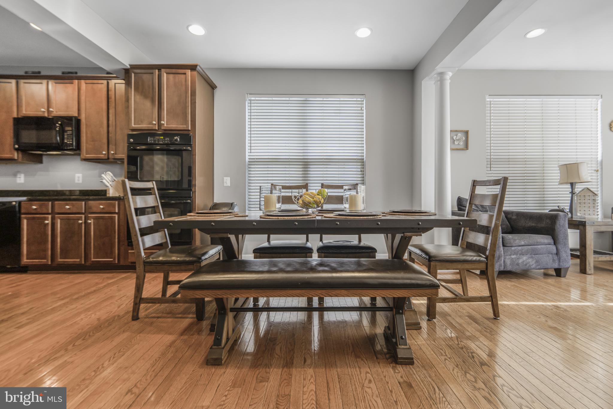 9709 Traver Street Bowie, MD 20721 - Photo 15 of 48 Modern dining space with warm wood accents.