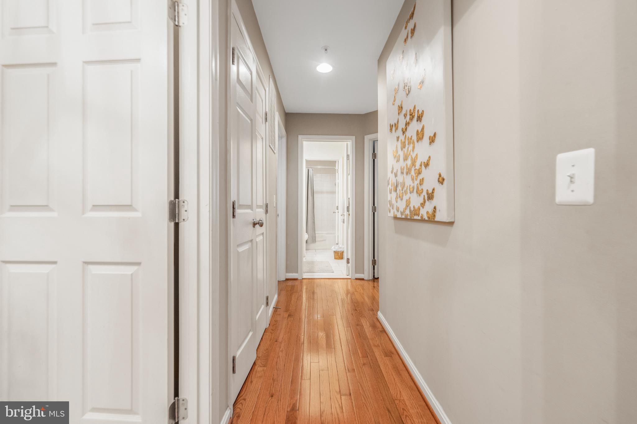 9709 Traver Street Bowie, MD 20721 - Photo 28 of 48 Inviting hallway wooden floors leading to bedrooms