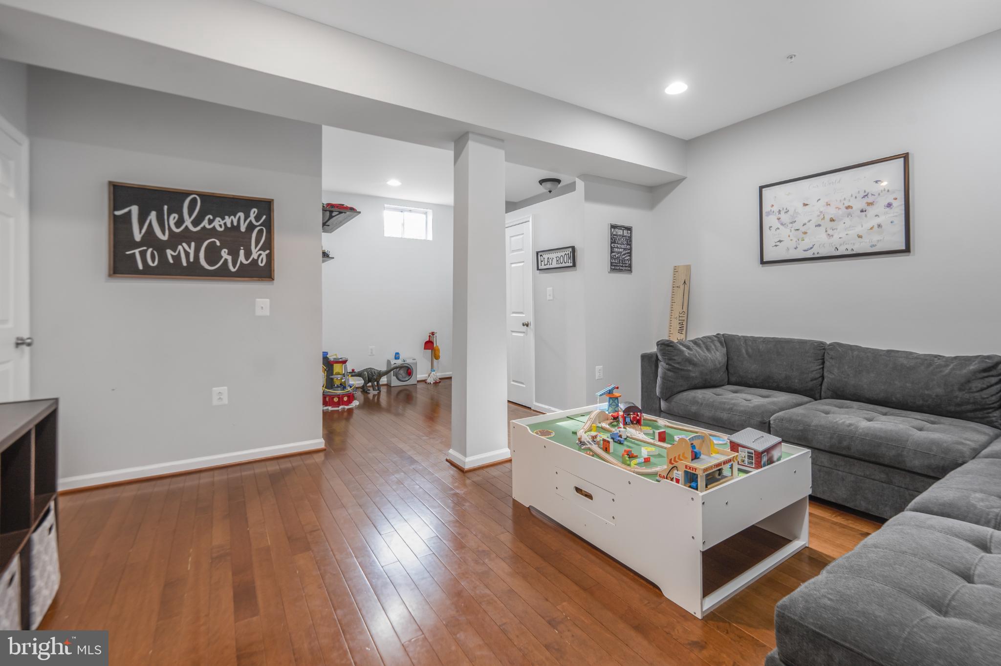 9709 Traver Street Bowie, MD 20721 - Photo 33 of 48 Spacious lower level living area warm wood floors.